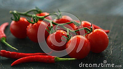 Fresh grapevine tomatoes and chili Stock Photo