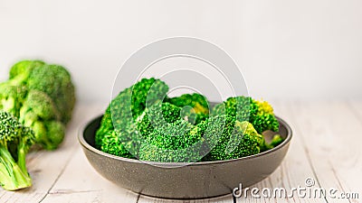 Fresh green broccoli on a light background. Macro photo green fresh vegetable broccoli Stock Photo