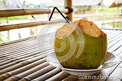 Fresh green coconut, young coconut ready to drink Stock Photo