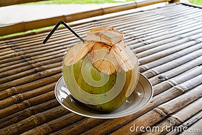 Fresh green coconut, young coconut ready to drink Stock Photo