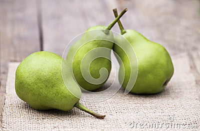 Fresh green healthy fruit pears on a wooden table Stock Photo