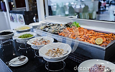 Fresh green mussel and shrimps in seafood on ice buffet bar Stock Photo