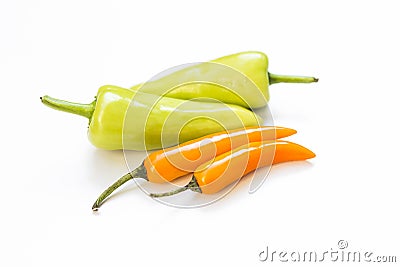 Fresh green and orange color chilli on white background Stock Photo