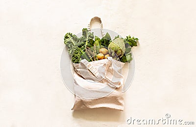 Fresh green produce in reusable shopping bag, top down view Stock Photo