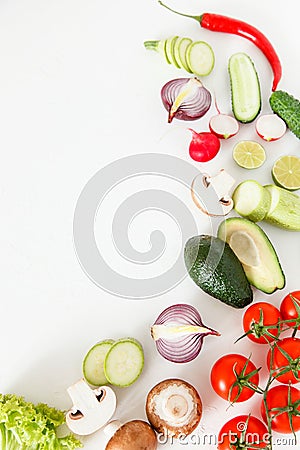 Fresh green and red vegetables lie on a white background, vegetarian food. Stock Photo