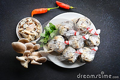 Fresh grey oyster mushroom on plate, cooked oyster mushroom for cooking food - processed food street mushroom package Stock Photo