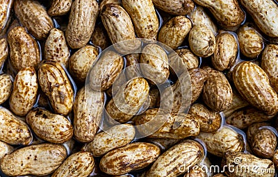 Fresh groundnuts in the water on the pot preparing for boiling. peanut texture by close - up taken. top view monkey nut photograp Stock Photo