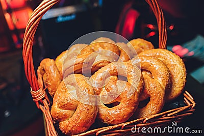 Fresh handmade original Bavarian pretzels from the domestic master baker on a green checkered tea towel many blurry Stock Photo