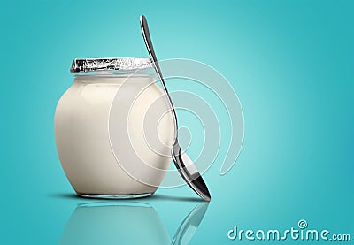 Healthy fresh yogurt with spoon on background Stock Photo