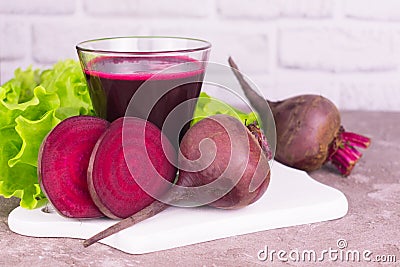 Fresh healthy beet juice in a glass on a white background. Stock Photo
