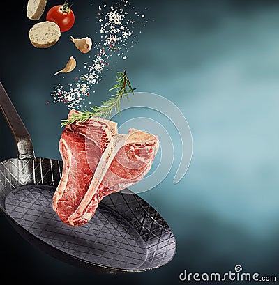 Fresh healthy raw T-bone steak with condiments Stock Photo