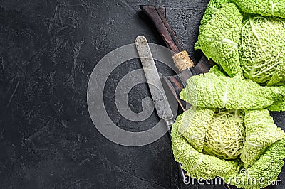 Fresh healthy savoy cabbage. Dark background. Top view. Copy space Stock Photo
