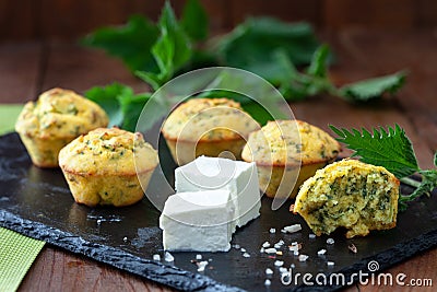 Healthy snack muffins with feta cheese and nettle. Stock Photo