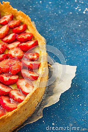 Fresh homemade strawberry shortcrust tart pie stuffed with custard vanilla cream . Sliced berries and mint leaf on the trendy Stock Photo