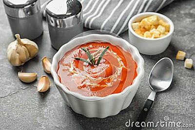 Fresh homemade tomato soup served with croutons and garlic on table Stock Photo