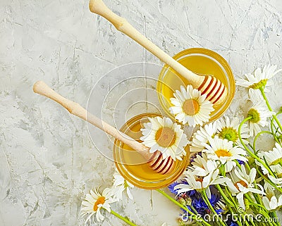 Fresh honey, daisy flower health dessert vitamin cornflower on gray concrete gray background organic Stock Photo