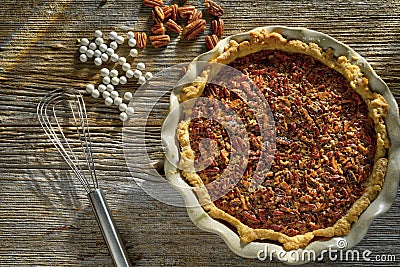 Fresh hot pecan pie served on a rustic table top Stock Photo