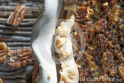 Fresh hot pecan pie served on a rustic table top Stock Photo