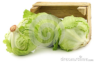 Fresh iceberg lettuce in a wooden crate Stock Photo