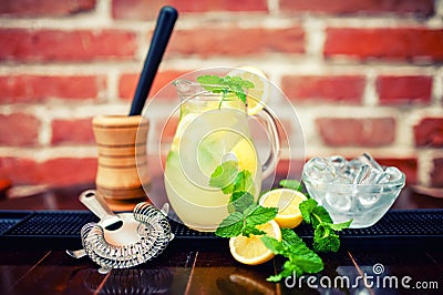 Fresh, iced mint lemonade in a jug with sliced lem Stock Photo