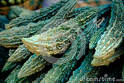 Fresh indian kakdi cuccumbers lying on market stall, close-up side view Stock Photo