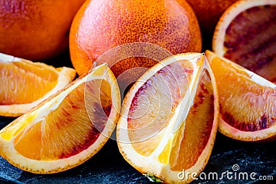 Fresh Juicy Blood Oranges Whole and Sliced Close Up Stock Photo