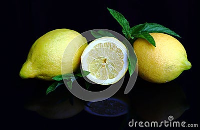 Fresh juicy lemons with peppermint Stock Photo