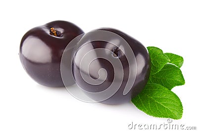 Fresh juicy organic plum with green leaf Stock Photo