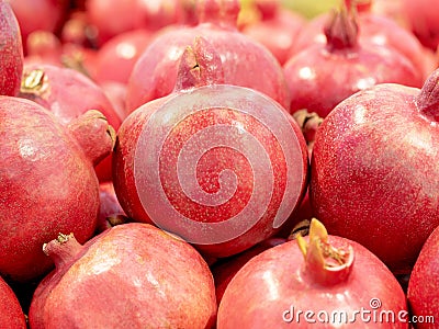 Fresh juicy pomegranate in the market. Superfood for a healthy diet full of beneficial elements Stock Photo