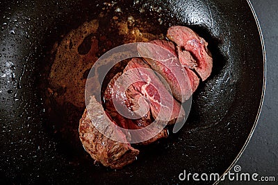 Fresh lamb meat being fried in the pan, medium rare tasty Stock Photo