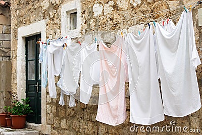 Fresh laundry hanging on a clothesline Stock Photo