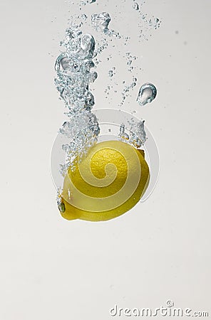 Fresh lemon drop on water with babble Stock Photo