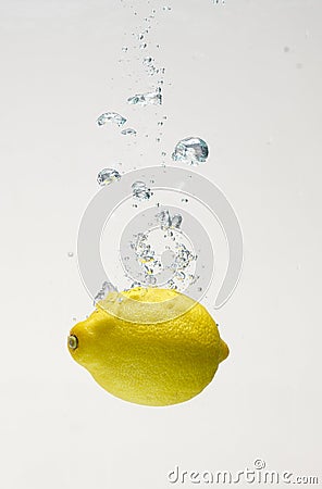 Fresh lemon drop on water with babble Stock Photo