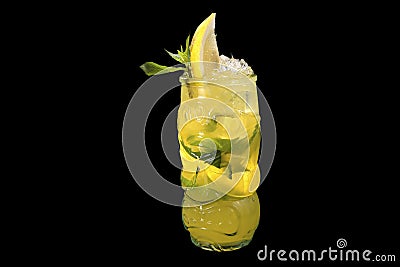 Fresh lemonade with Elderflower syrup in a bottle with lemon and ice with reflection Stock Photo