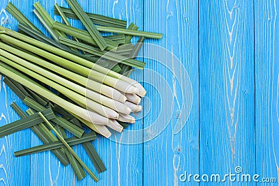 Fresh lemongrass or citronella grass leaf on blue wooden plank Stock Photo