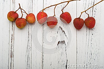 Fresh lichees on white wood background Stock Photo