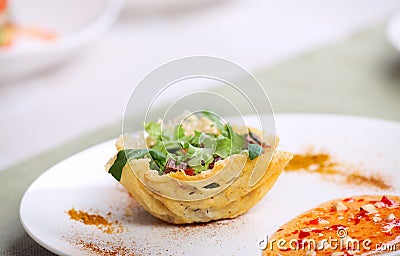 Fresh light salad in parmesan cheese basket Stock Photo