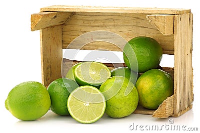 Fresh lime fruit in a wooden crate Stock Photo