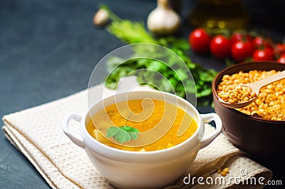 Fresh liquid pea soup on chicken broth. bean soup with parsley. healthy breakfast. black concrete background. selective focus. Stock Photo