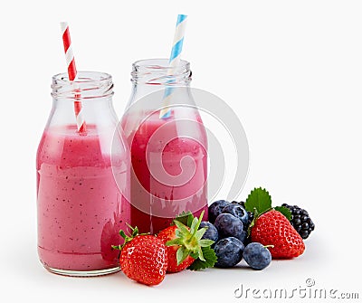Fresh liquidised berry smoothies in bottles Stock Photo