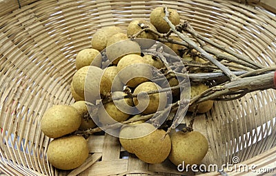 Fresh longan in bamboo basket Stock Photo