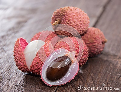 Fresh Lychees on wooden background Stock Photo