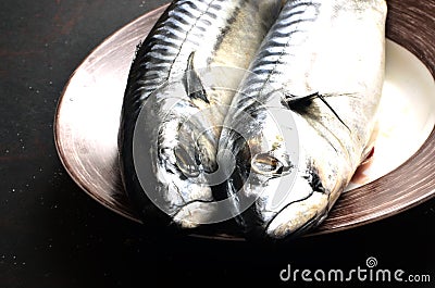Fresh mackerel for cooking on a black background Stock Photo