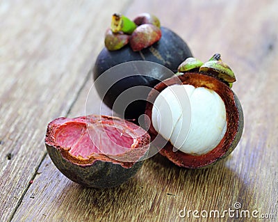 Fresh mangosteen fruit on wood Stock Photo