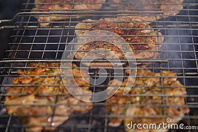 Fresh meat on grill outdoors Stock Photo