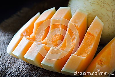 Fresh melon sliced on wooden Stock Photo