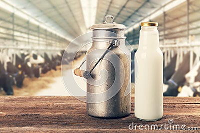 Fresh milk bottle and can on the table in cowshed Stock Photo