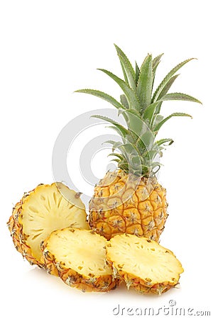 Fresh mini pineapple fruit and a cut one Stock Photo