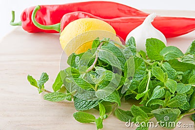 Fresh mint leaves, lemon, bell pepper and garlic Stock Photo