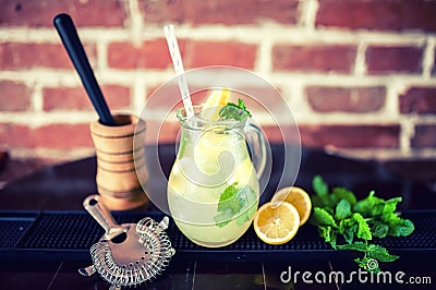 Fresh mint lemonade with ingredients in a jug. vintage effect Stock Photo